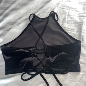 All black velvet halter top with crossing toes in the back.